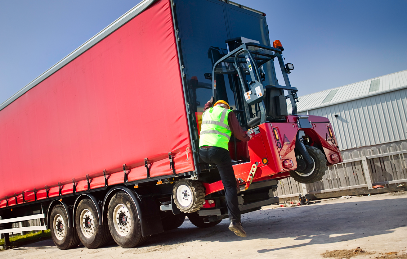 A member of staff in high viz jacket with one of our Moffetts