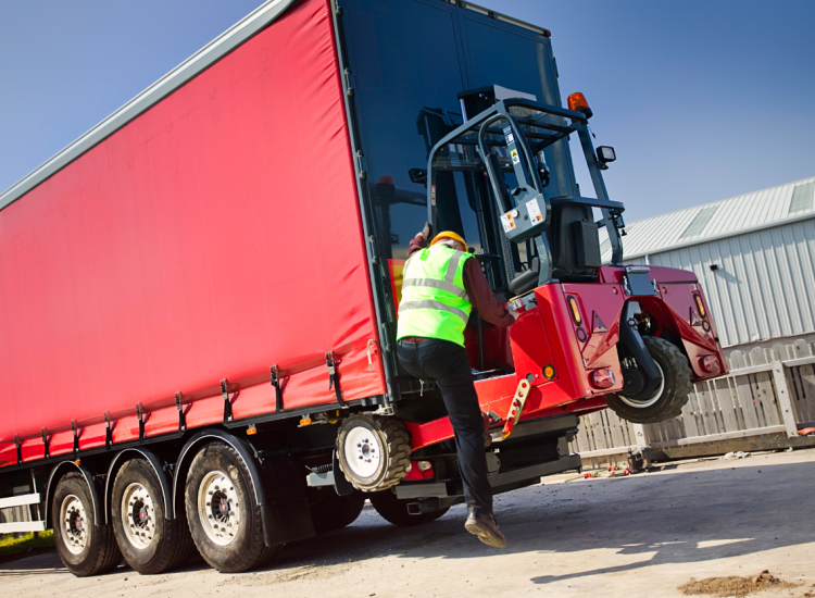 A member of staff in high viz jacket with one of our Moffetts