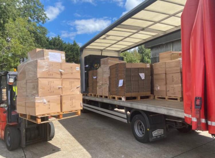 Pallets being loaded onto the side of one of our lorries